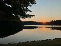 A photo of a sunset over a lake